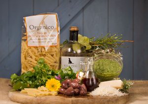 Taste of Cotna Eco Retreat Italian hamper with home-made green basil pesto, organic pasta, organic salad leaves grown in our no-dig garden for holiday guests glamping in our yurts on the Roseland Peninsula, Cornwall