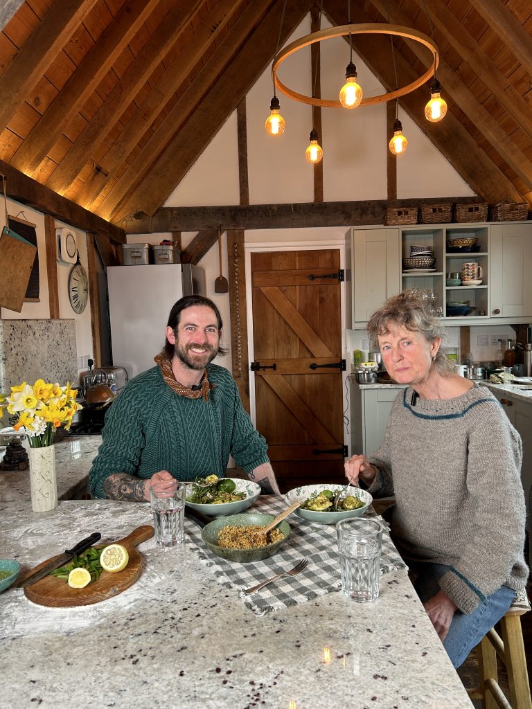 James Strawbridge with Sara in the kitchen at Cotna Eco Retreat, eating delicious gnocchi with wild garlic pesto